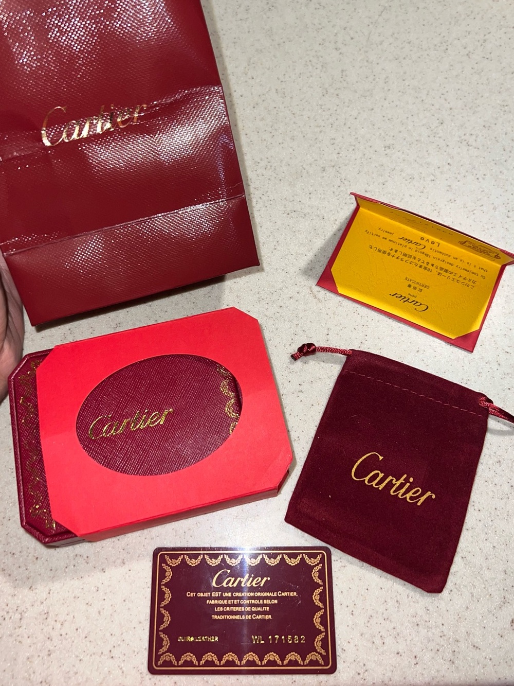 Cartier Red and Burgundy Jewelry Pouch & Card Holder Set and gold gem bracelet